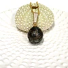 Carved Tahitian pearl pendant necklace