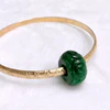 Bangle ALII - rondelle carved jade bead (B566)